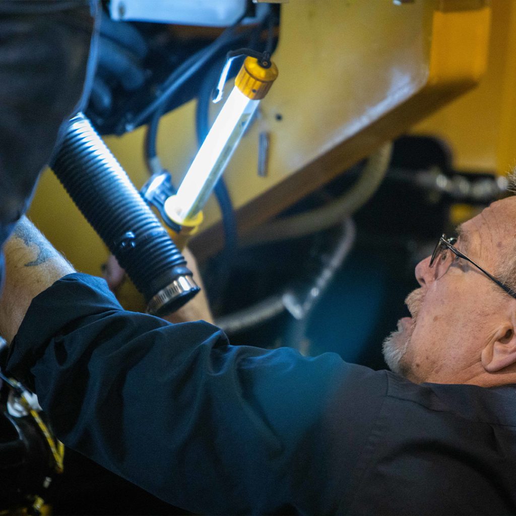 Worker Inspecting SANY Equipment